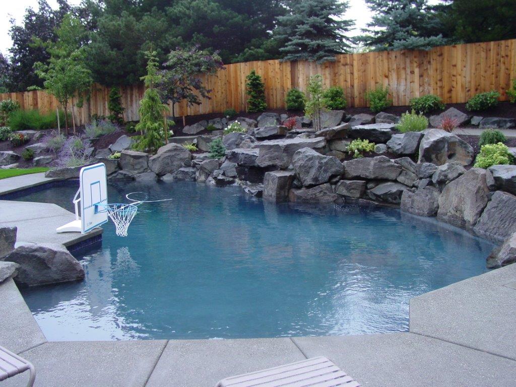 Image of a Raleigh Hills Backyard Pool Design and Installation by Drake's 7 Dees